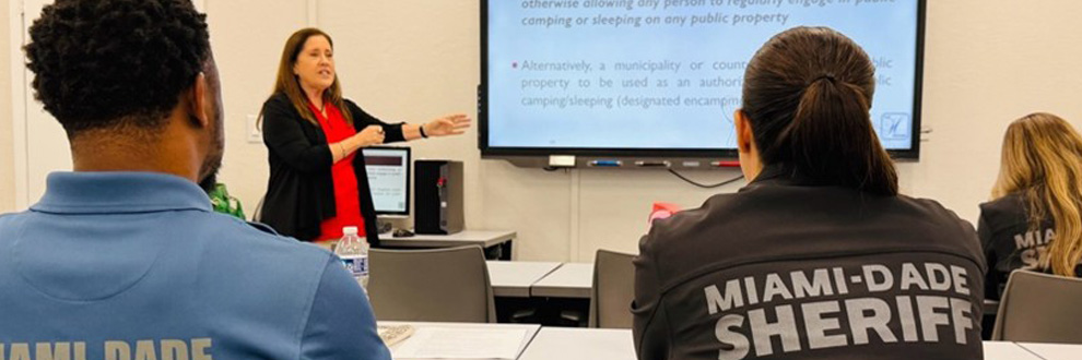 Law enforcement staff in classroom training on homelessness response